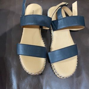 Black sandal never worn but not in it’s original box.